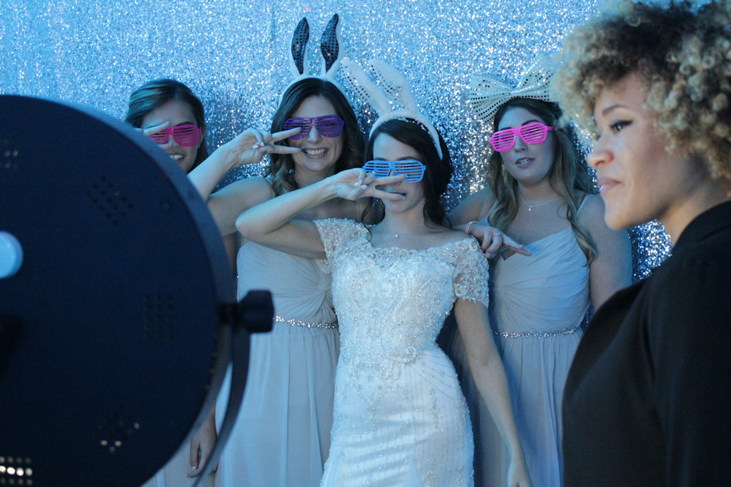 bride and bridesmaids in photo booth